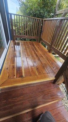 Water pressure deck and rails and do maintenance with caulking and re stain deck