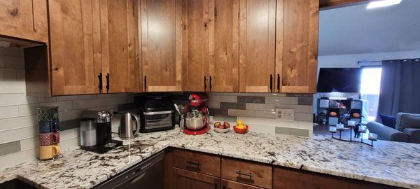 New Kitchen- had the tall penisula counter removed, relocated the stove so we could have a huge section of open counterspace.