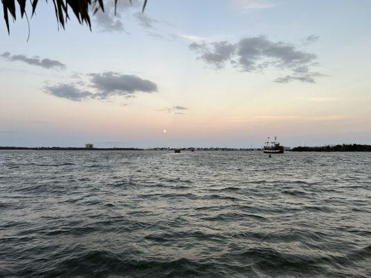 Sun setting on Fort Myers Beach from tiki boat