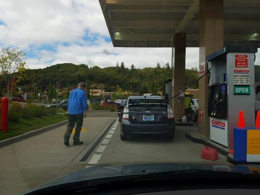 Costco Jerk: [definition] Drives across three lanes to cut in front with a Primus hybrid. Pulls additional gas can out of his trunk.