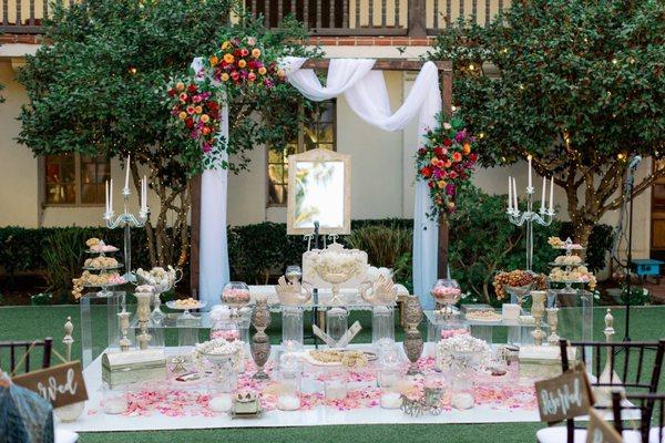 Wedding arch and rose petals on Sofreh