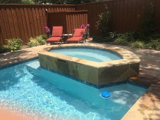 Added hot tub into deep end of pool