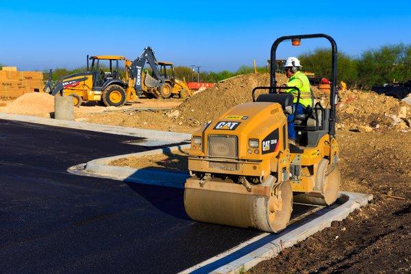 Asphalt paving crew in Round Rock, TX.