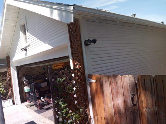 This garage was in poor shape, our client wanted to restore rather than rebuild. We replaced siding, repaired and painted the whole garage.