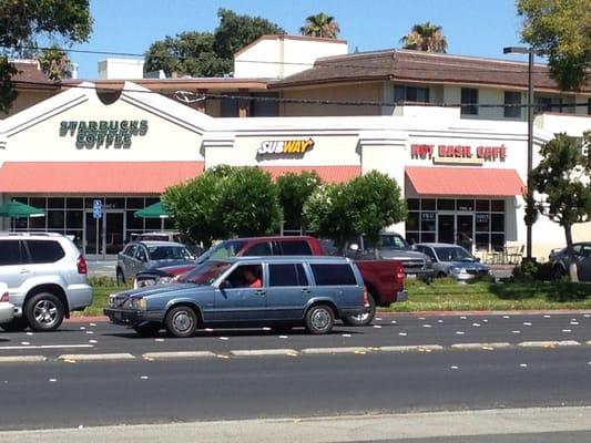 Subway next to Starbucks at a busy intersection. Don't blink or you'll miss it