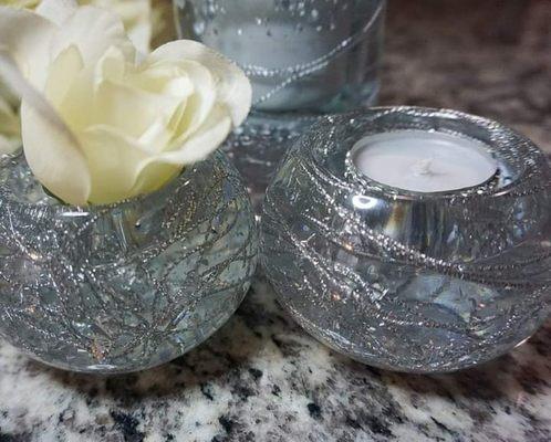 These are resin/embedded silver flakes with wire design. 
Elegant pieces that will make any living room light up.