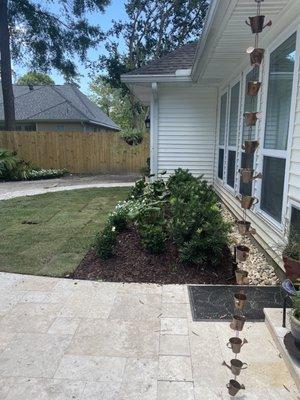 Backyard walkway and garden. New stonework