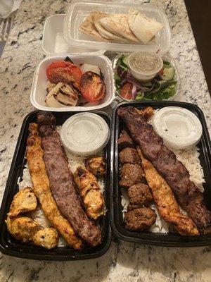 Skewer Platters: Chicken Kebab, Chicken Koobideh, Beef Koobideh, Side salad, Steak Shish Kebab (upcharge), Onions & Tomatoes, Baked Pita