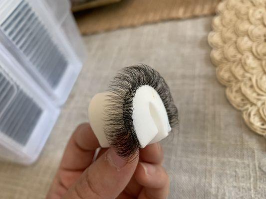 Full volume lash extensions on a make up sponge.