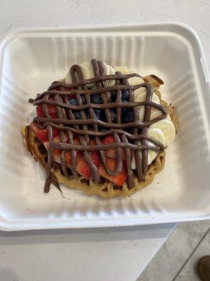 Protein waffle with fresh strawberries, bananas, blueberries, and Nutella. 24 g of protein