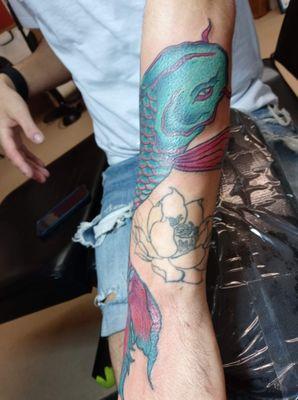 This INKpression was done by our artist Ruby!! Fixing what he had prior. Flower was not our original work..