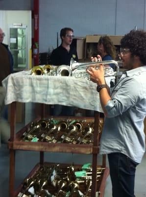 Chris Coletti of the Canadian Brass trying out cornets and trumpets