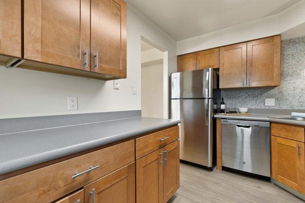 This is our contemporary kitchen style, complete with soft-close cabinetry, glass tile backsplash, and stainless steel appliances.