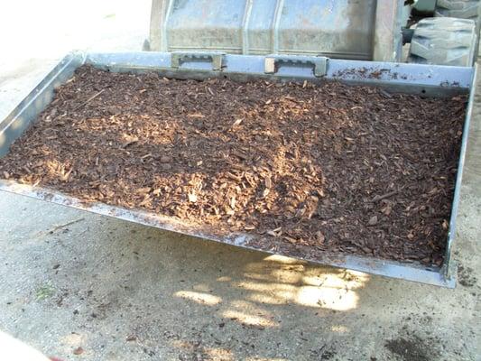 Playground mulch being delivered.