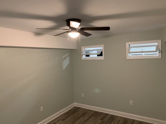 Home office In the finished basement window to allow natural lighting from the Walk-out sliding door