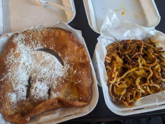 Fried dough with sugar on left and cheese fries