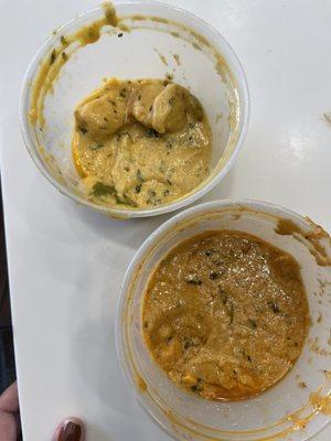 Butter chicken on top (yellow) and sahi paneer on bottom (orange)