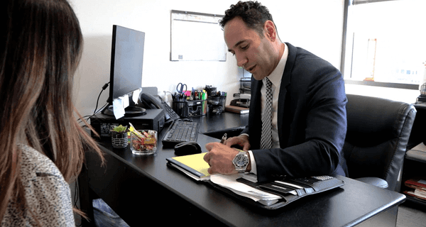 Martin Gasparian, Esq. meets with a personal injury client in our Visalia, CA office