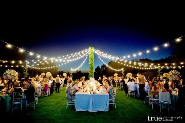 On the croquet lawn at Rancho Valencia under a canopy of lights