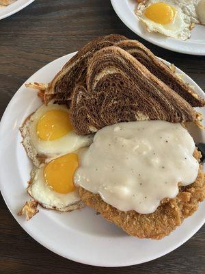 Chicken fried steak, eggs, hash browns, rye toast