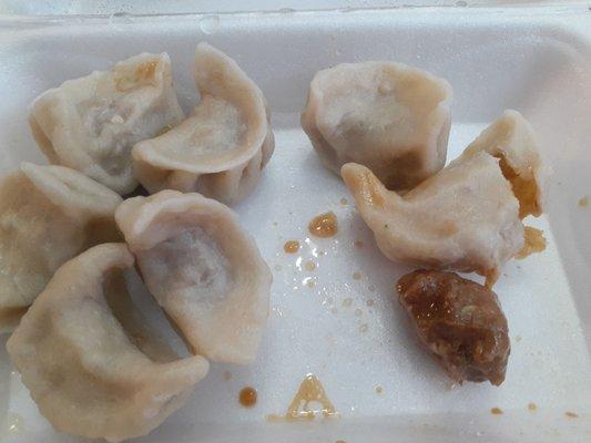 That turd looking thing is supposed to be the meat and veggie mix inside of the dumpling.