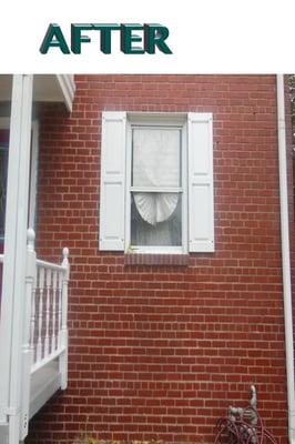 After- Exterior work on bricks, shutters, porch and eaves. White paint removed from brickx. See before pic.