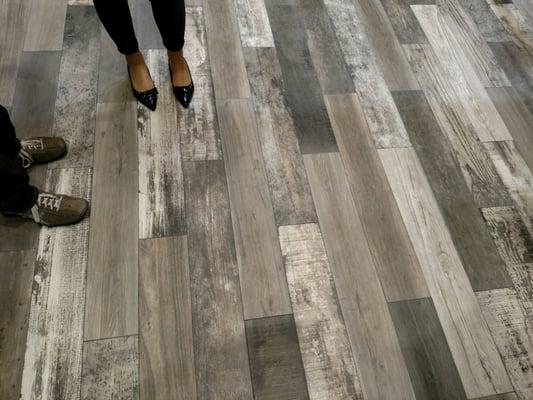 Distressed wood plank tile.  Yes, TILE!  Use it in a shower, outdoors, or for an indestructible kitchen floor.