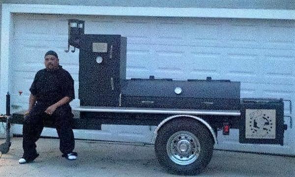 Owner and Pitmaster Tommy with our custom made Klose smoker.