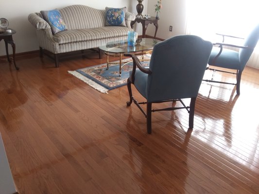 Freshly refinished hardwood floor in living room.