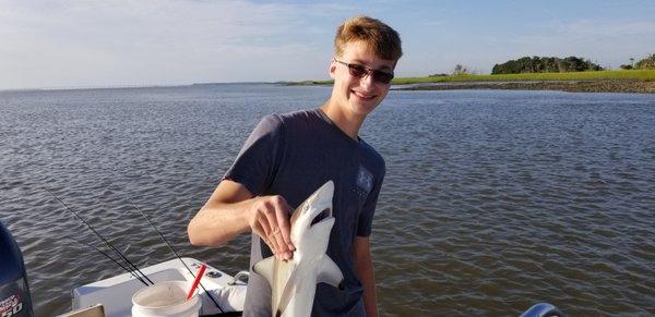 My boy catching a Black Tip Shark!