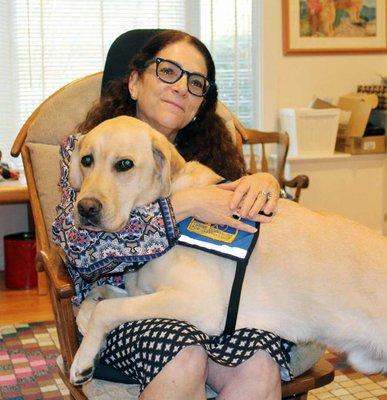 Dr. Spector with Robert, her certified facility dog.