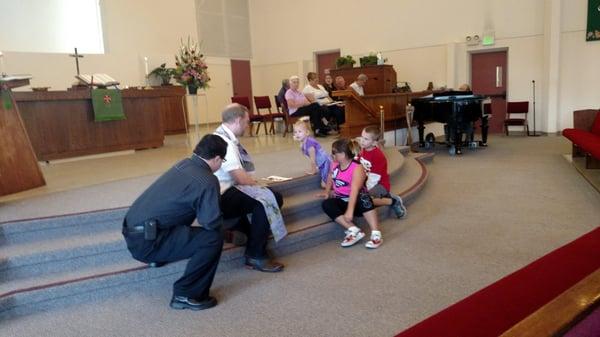 Pastor Sam leading the children's moment