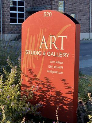 Sign in garden in front of the gallery