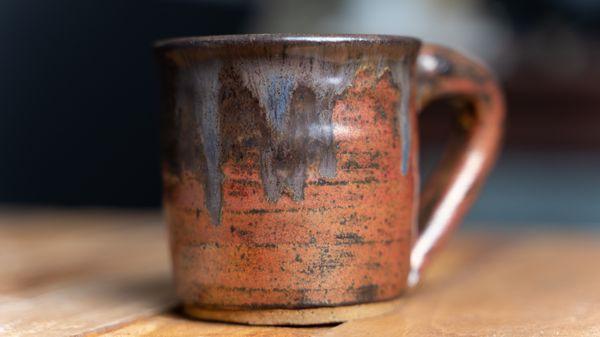 Custom ceramic copper mug handmade on the pottery wheel.