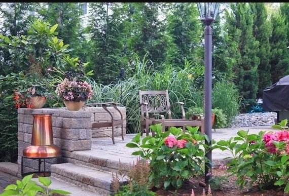 Precast walls and pavers with plantings and lighting.