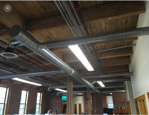 Commercial office exposed spiral ductwork; heating and AC capability