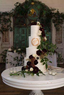 Four-tier wedding cake (floral provided by Jules Floral Designs)