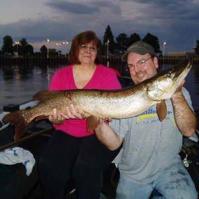 Owner Diane and manager Chris with a 44 inch pike that Diane caught and released.