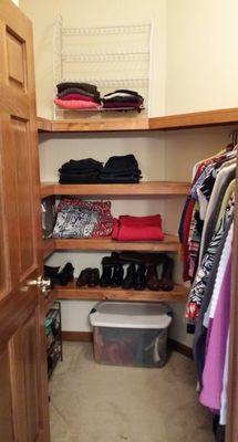 A master closet with PLENTY of space - even after putting all the client's clothes in it (she previously required 2 closets)