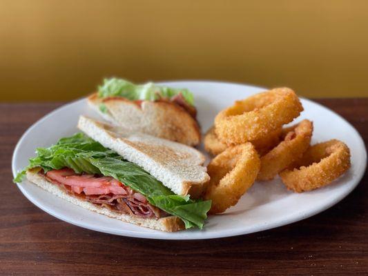 BLT Sandwich with onion rings.