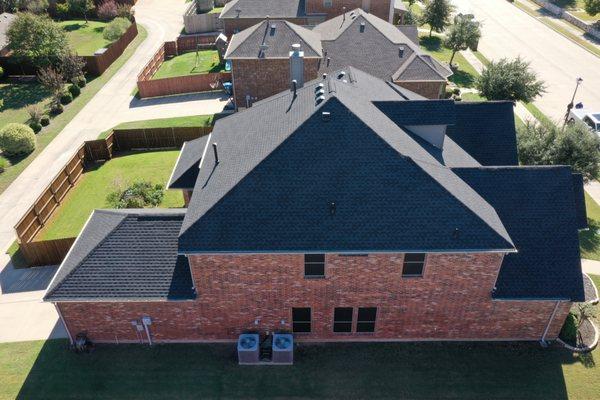 This shingle color really compliments the brick on this house!