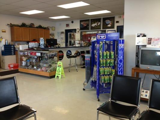 A clean, comfortable waiting area in a modern shop.