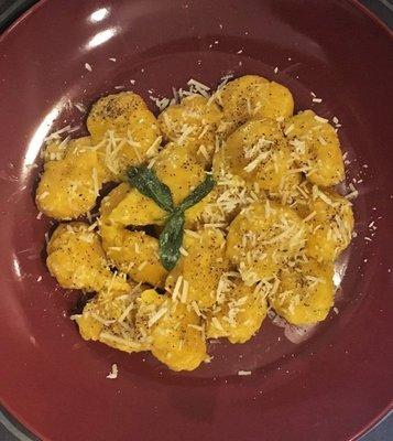 Homemade squash gnocchi in a butter and sage sauce, topped with pecorino Calabrese cheese