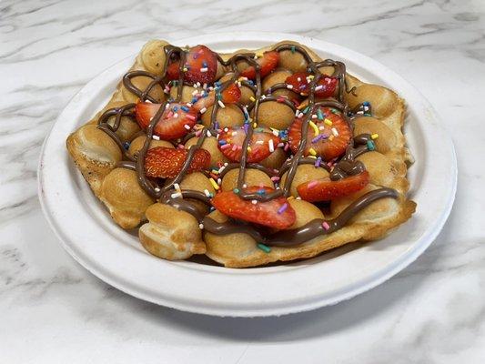 Plain Waffee with Nutella, fresh strawberries and sprinkles