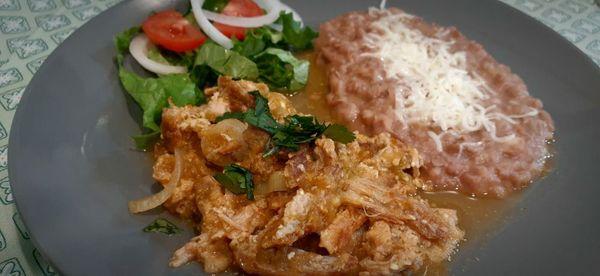 Skin pork on salsa verde and fried beans