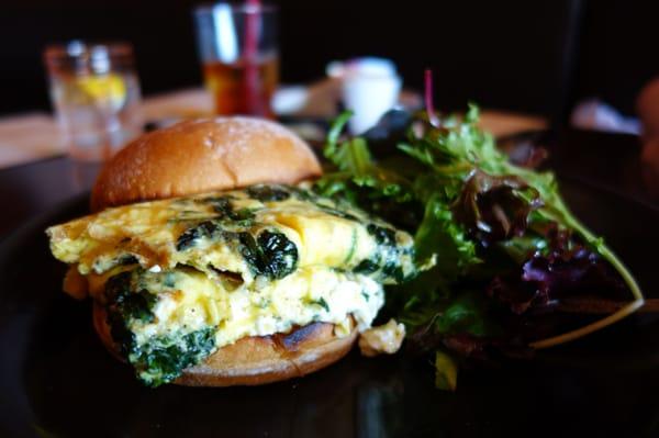 Egg Panino with Spinach, Roasted Peppers, Goat Cheese, Potato Bun and a Side Salad