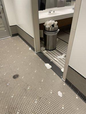 Rather than push down the paper towels into the trash can let's pile them and throw them on the floor