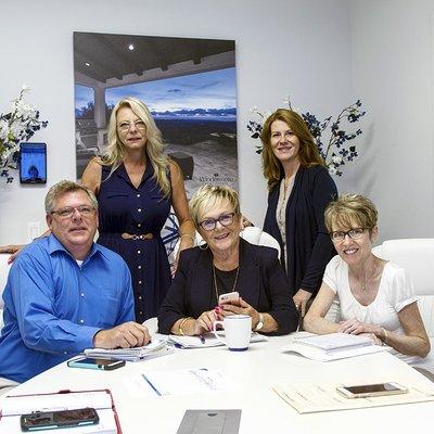 Faye Hines surrounded by team members Steve Bryie, Apryl Barbin, Amy Dubord, and Cia Farrar Knapp.