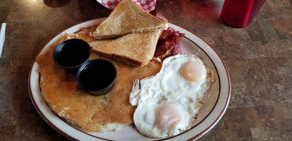 Pancake, eggs, toast, and bacon