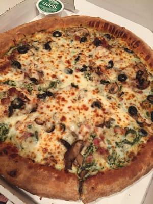 Spinach Alfredo (large regular crust) with bacon, mushroom, black olives and onions. Yum!!!